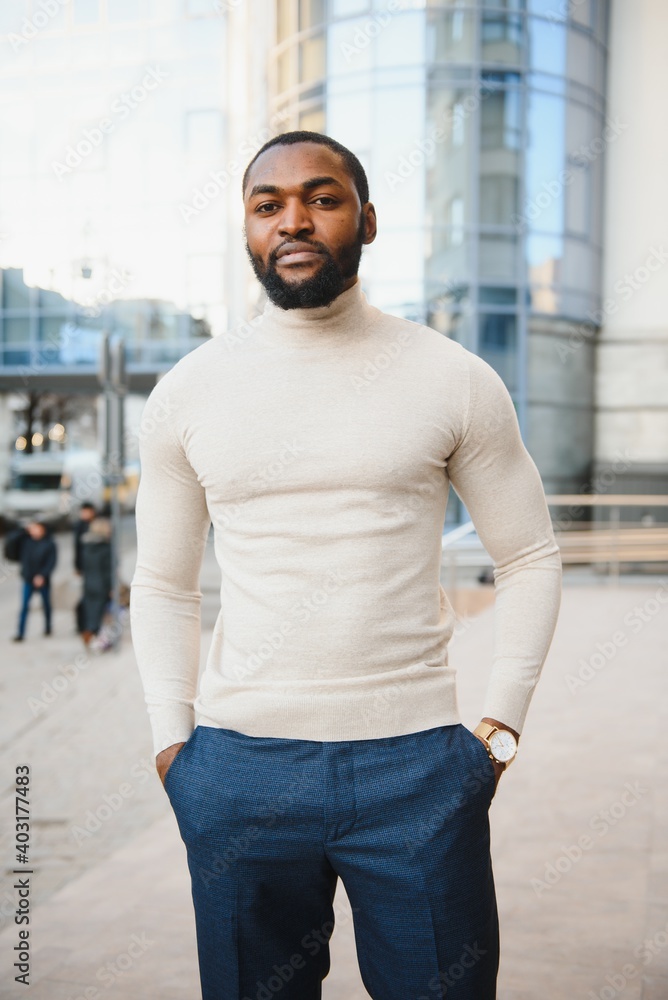 African American man in stylish new clothes on the street African American man in stylish new clothes on the street