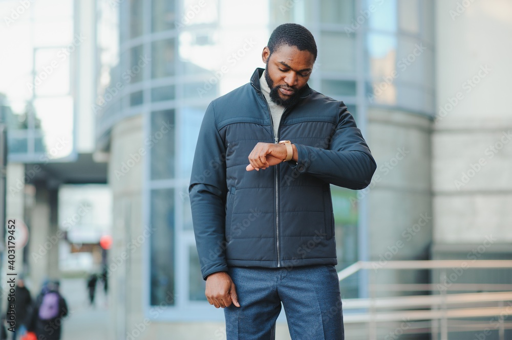 African American man in stylish new clothes on the street African American man in stylish new clothes on the street