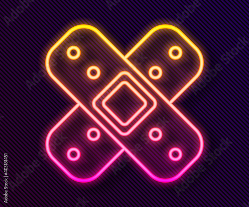 Glowing neon line Crossed bandage plaster icon isolated on black background. Medical plaster, adhesive bandage, flexible fabric bandage. Vector Illustration.