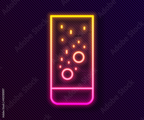 Glowing neon line Effervescent aspirin tablets dissolve in a glass of water icon isolated on black background. Vector Illustration.