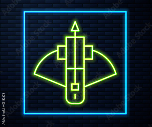 Glowing neon line Battle crossbow with arrow icon isolated on brick wall background. Vector.