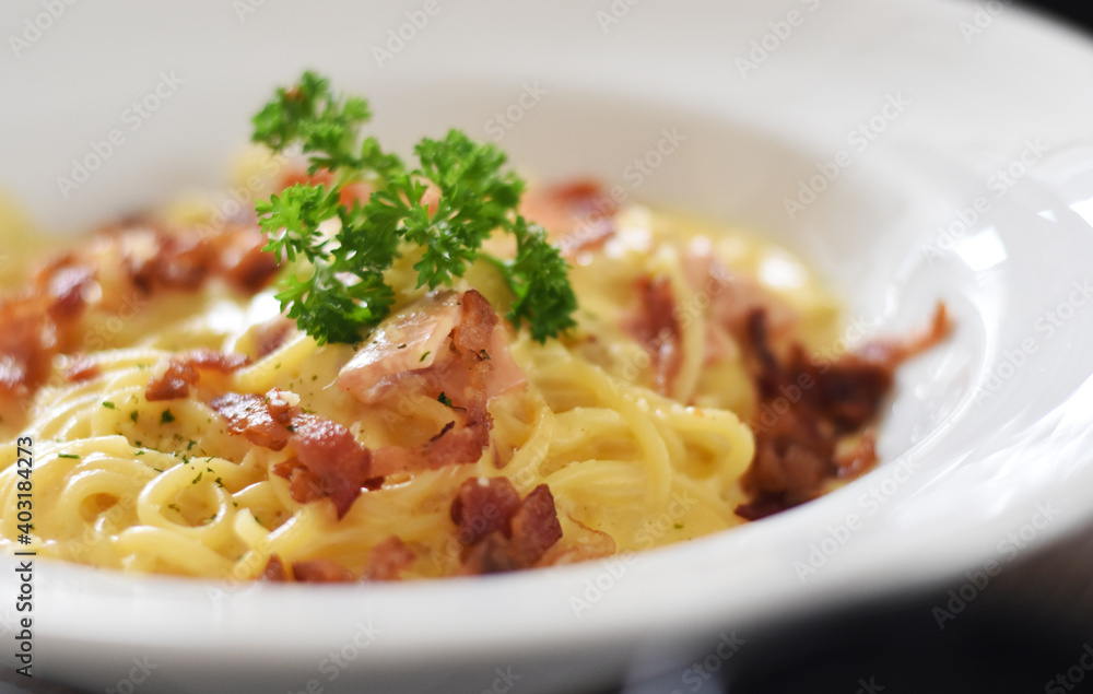 Soft focus Carbonara spaghetti in white plate
