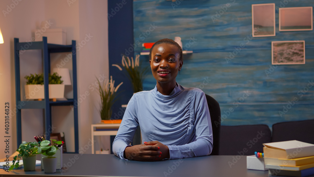Black business woman talking in front of camera having video call with partners. Pov of african freelancer working with remotely team discussing during online conference meeting using internet. Black business woman talking in front of camera having video call with partners. Pov of african freelancer working with remotely team discussing during online conference meeting using internet.