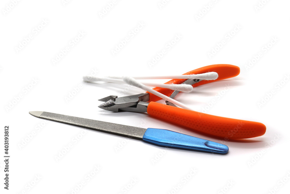 nail clippers ear sticks and nail file on white background nail clippers ear sticks and nail file on white background