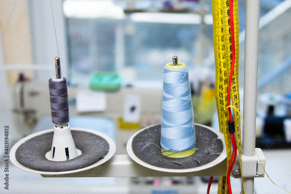 Sewing thread on a sewing machine in spools. Sewing thread on a sewing machine in spools.