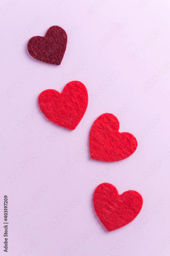 Flatlay red hearts on a pink background. Concept of Valentine's day, wedding. Copy space.