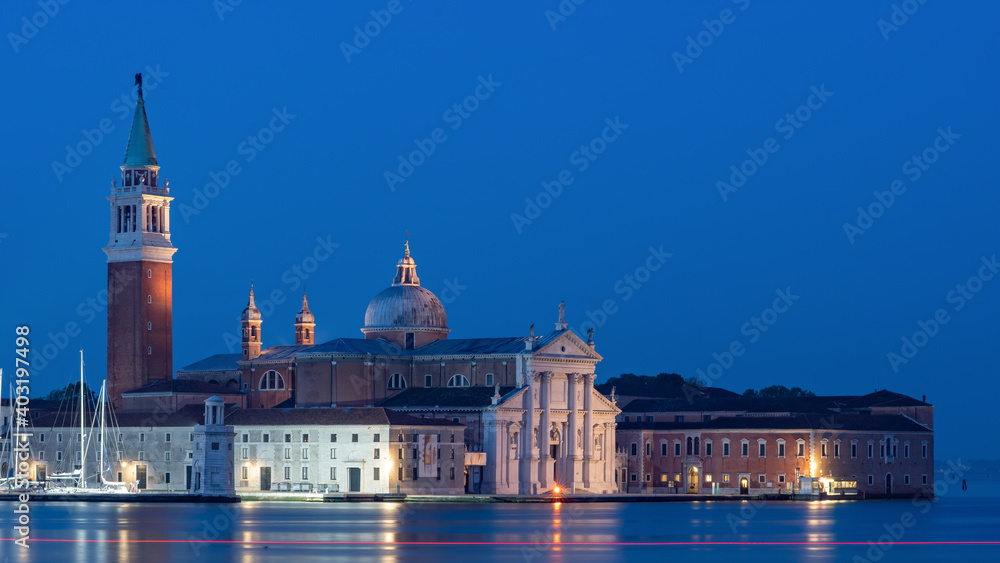 San Giorgio Maggiore Venice Italy photographed from over the grand canal to show the island, churches and buildings. 