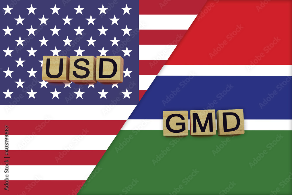 USA and Gambia currencies codes on national flags background USA and Gambia currencies codes on national flags background