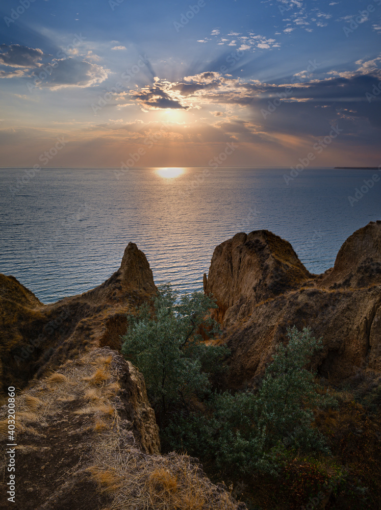 Picturesque sunset landscape of Stanislav clay mountains and canyons above Dnipro river bay near the Black sea, Ukraine, Kherson Grand Canyon.