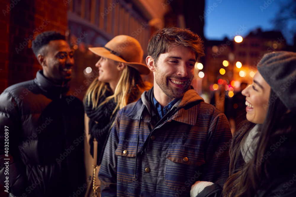 Group Of Friends In City Outdoors On Night Out Together Group Of Friends In City Outdoors On Night Out Together