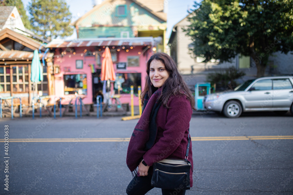 Beautiful woman smiling and walking in the street Beautiful woman smiling and walking in the street