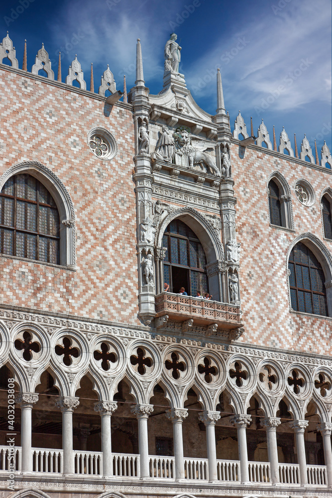 Front view closeup of white Doge's Palace. White tracery facade in Venice