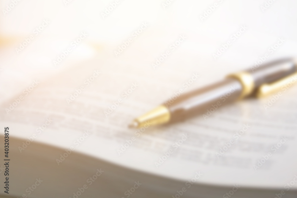 Fototapeta premium blur image of text book with pen