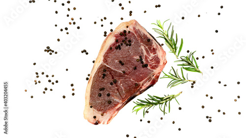 Bild auf Leinwand Steak with rosemary and pepper on a white background.