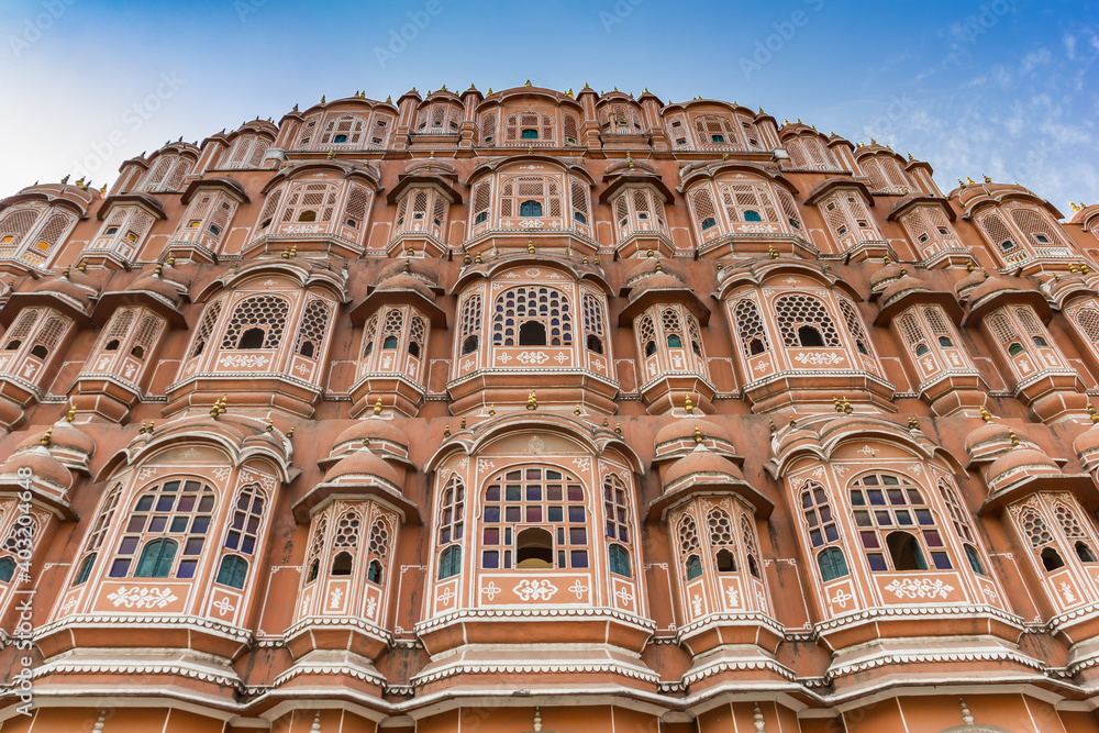 Colorful pink and orange facade of the Palace of the Winds in Jaipur, India