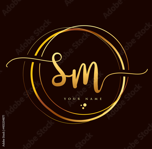 SM Initial handwriting logo golden color. Hand lettering Initials logo branding, Feminine and luxury logo design isolated on black background. photo