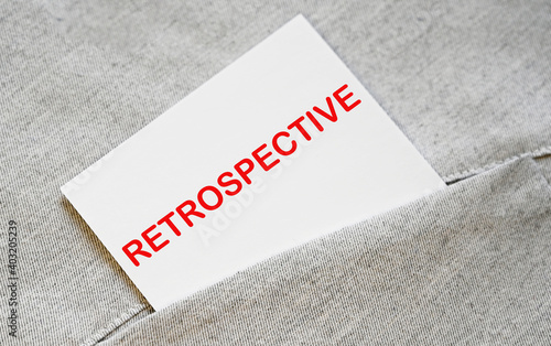 Canvas Print RETROSPECTIVE text on the white sticker in the shirt pocket.
