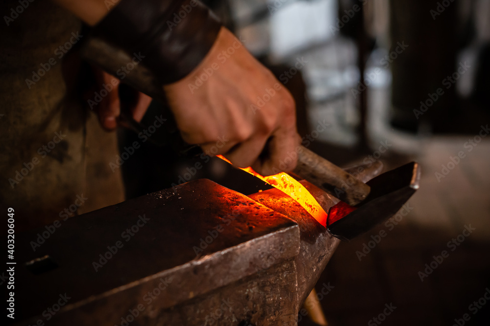Detail shot of metal being worked at a blacksmith forge Detail shot of metal being worked at a blacksmith forge