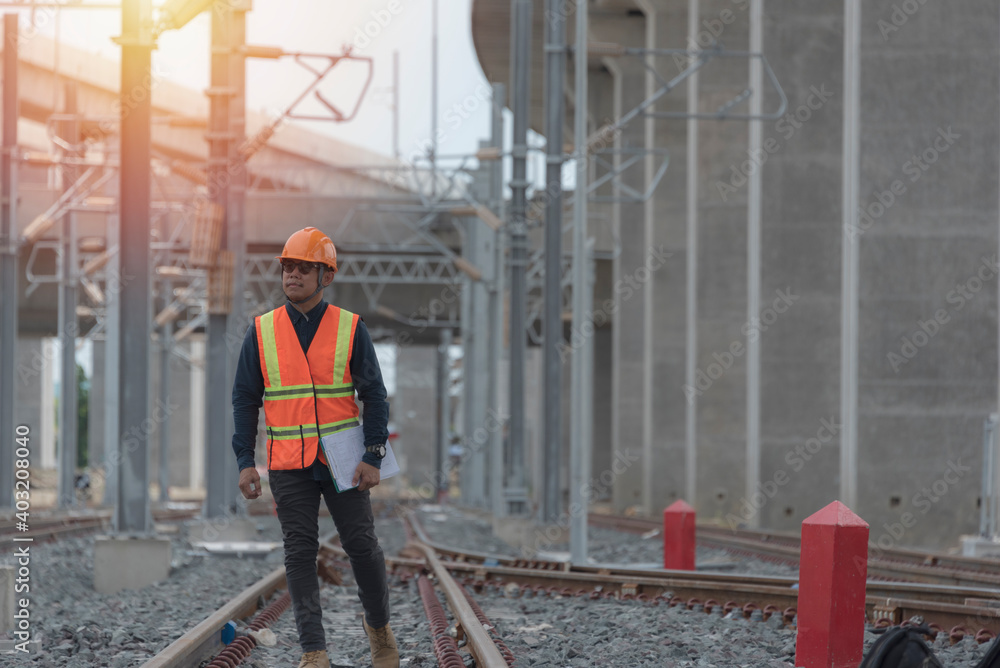 Engineer on railways. engineer train on the railway. Worker walk on railway. engineer  railway concept.