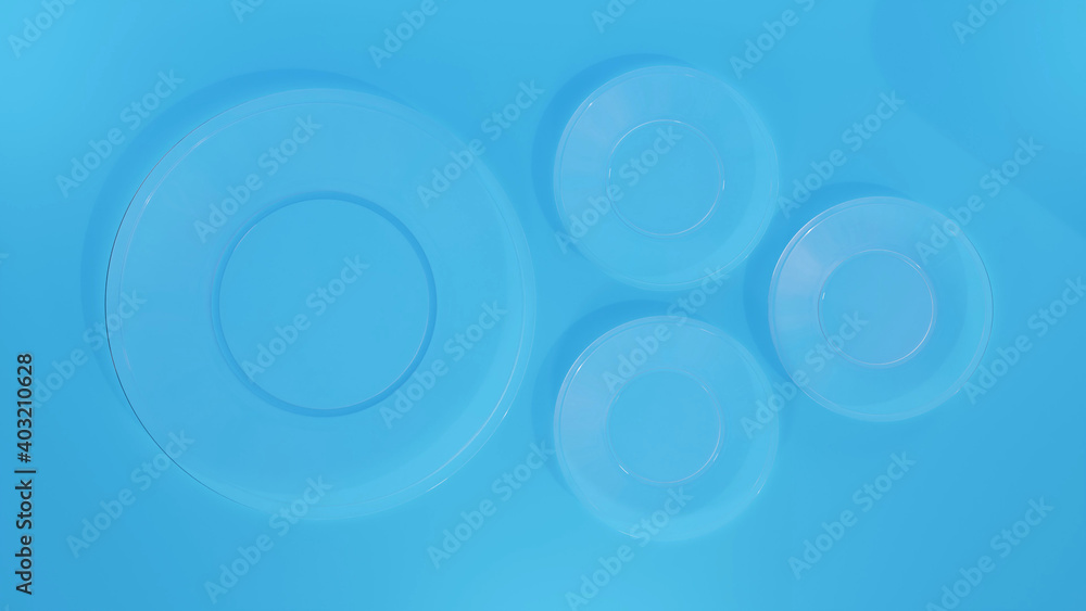 4 glass plates on a blue background, top view. 4 glass plates on a blue background, top view.