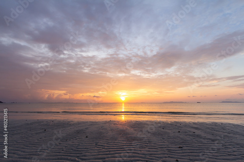 Beautiful tropical purple beach sunset with colourful sea sky