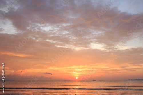 Beautiful tropical golden beach sunset with colourful sea sky