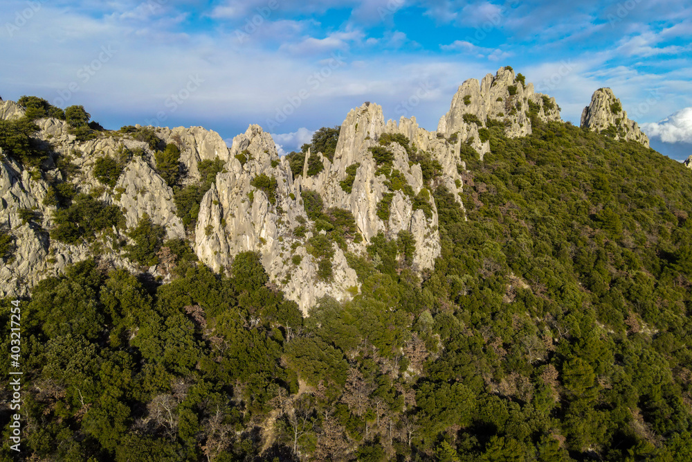 Aerial view of les Dentelles de Montmirail in front of the Mont Ventoux in the french alps