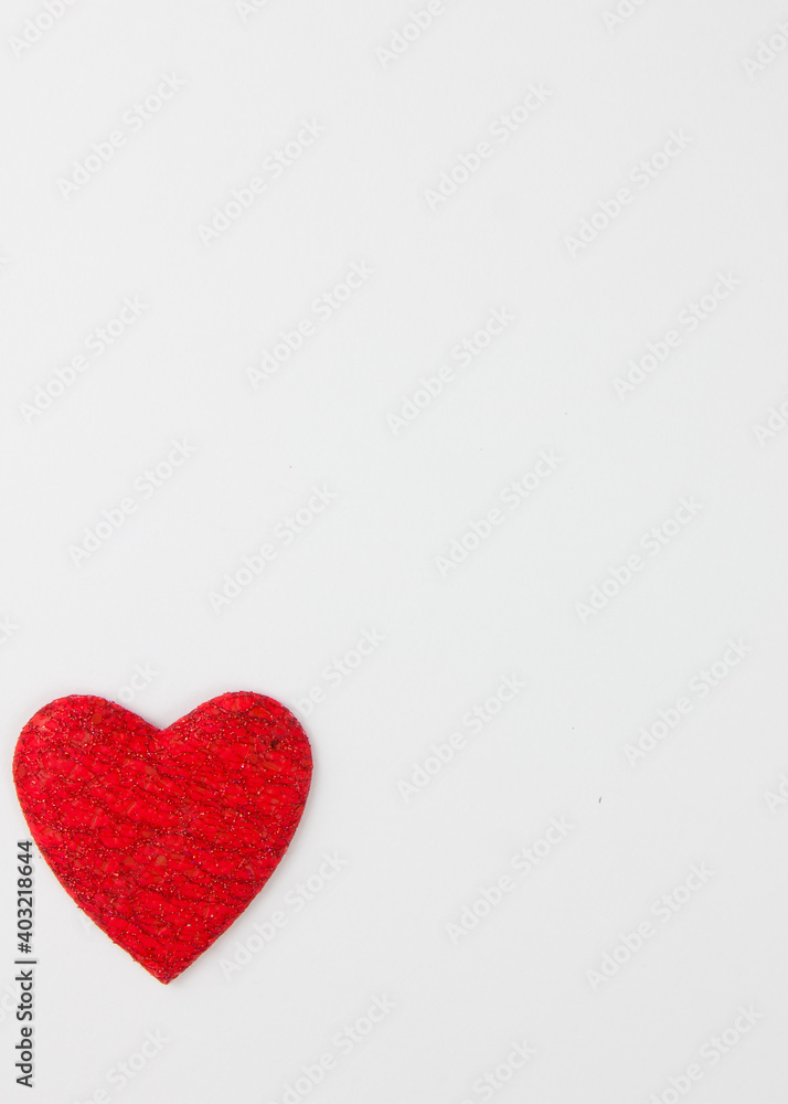 Red heart on a white background. Festive background. Minimalism. Copy space. St. Valentine's Day background Red heart on a white background. Festive background. Minimalism. Copy space. St. Valentine's Day background