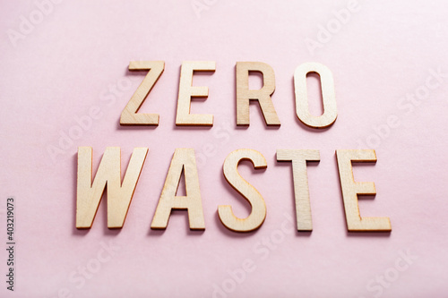 zero waste word text wooden letters on pink background