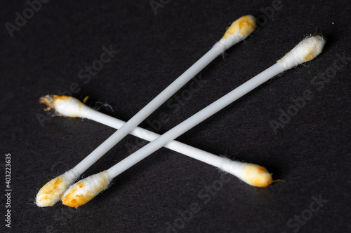 White ear sticks used on a black background