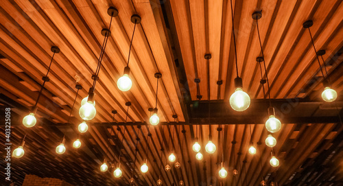 Fototapeta Naklejka Na Ścianę i Meble -  Lighting bulb hanging at wooden ceiling