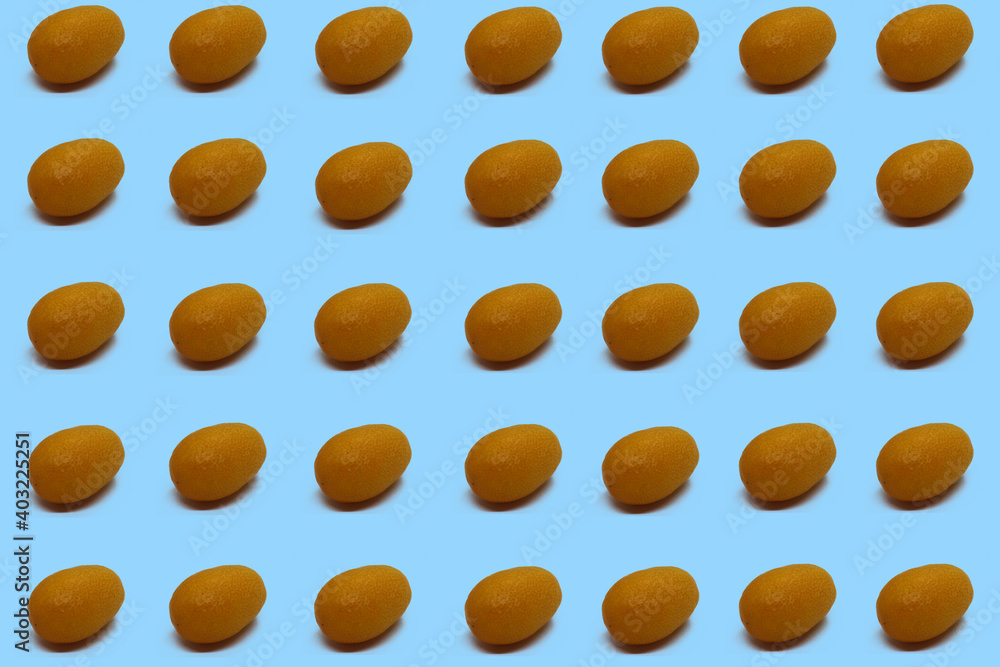 paw prints, kumquats fruits, kumquat fruit on isolated green background or surface paw prints, kumquats fruits, kumquat fruit on isolated green background or surface
