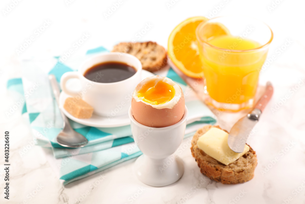 breakfast with coffee cup, orange juice and soft boiled egg breakfast with coffee cup, orange juice and soft boiled egg