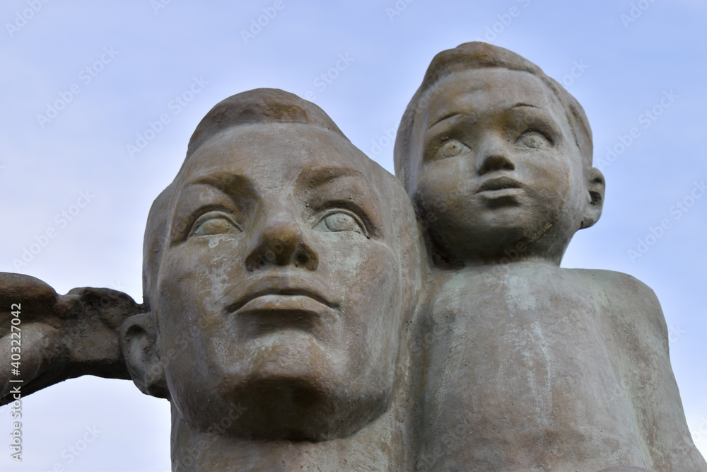 statue of man with a boy statue of man with a boy