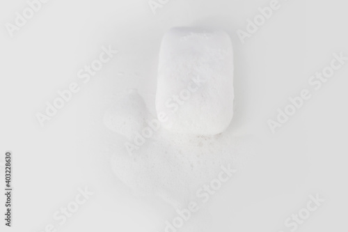 Soap with foam on a white background Soap used in everyday life, including washing, bathing