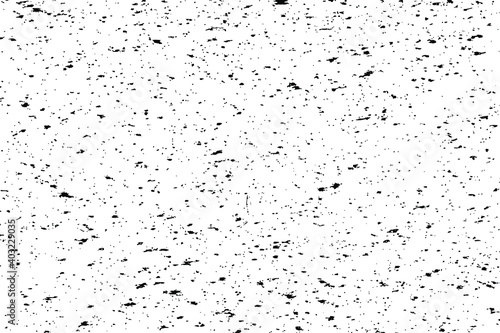 Grunge mottled texture of an old dirty surface. Monochrome messy background of a distressed wall with small noise, spots and graininess. Overlay template. Vector illustration