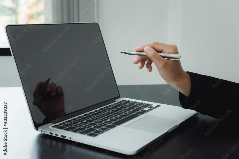Hands of businesswoman in casual talking about the business plan and pointing at a computer screen to explain to colleagues. Hands of businesswoman in casual talking about the business plan and pointing at a computer screen to explain to colleagues.