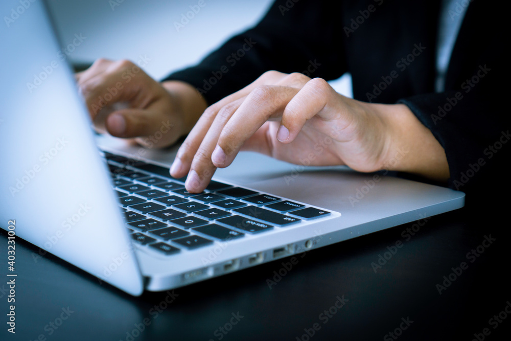 Female finance staff , Business women working at home, typing on keyboards, typing company profit reports for tomorrow morning meetings with her boss, working at home ideas Female finance staff , Business women working at home, typing on keyboards, typing company profit reports for tomorrow morning meetings with her boss, working at home ideas