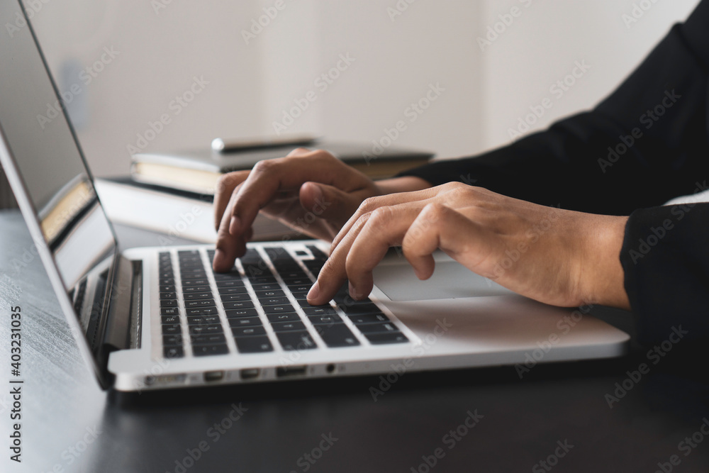 close up of a woman hand typing on the keyboard at home office typing for check electronic mail to prepare the meeting business. close up of a woman hand typing on the keyboard at home office typing for check electronic mail to prepare the meeting business.