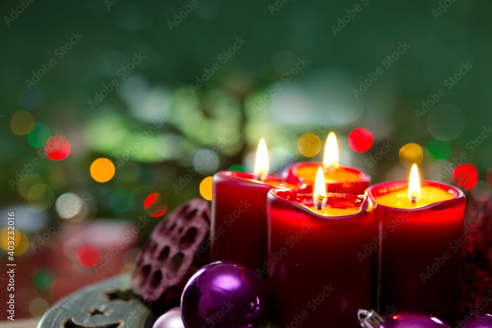 Four red candles for Advent. Christmas background.