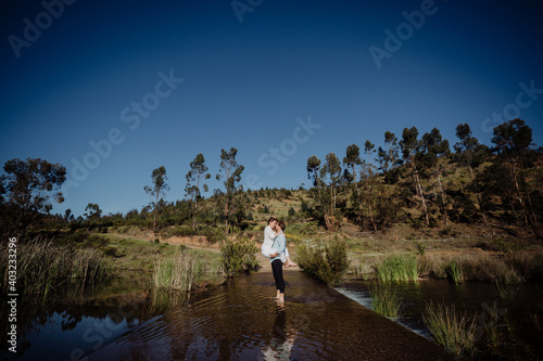 Couple in love in the water  man lifting the woman. LOVE