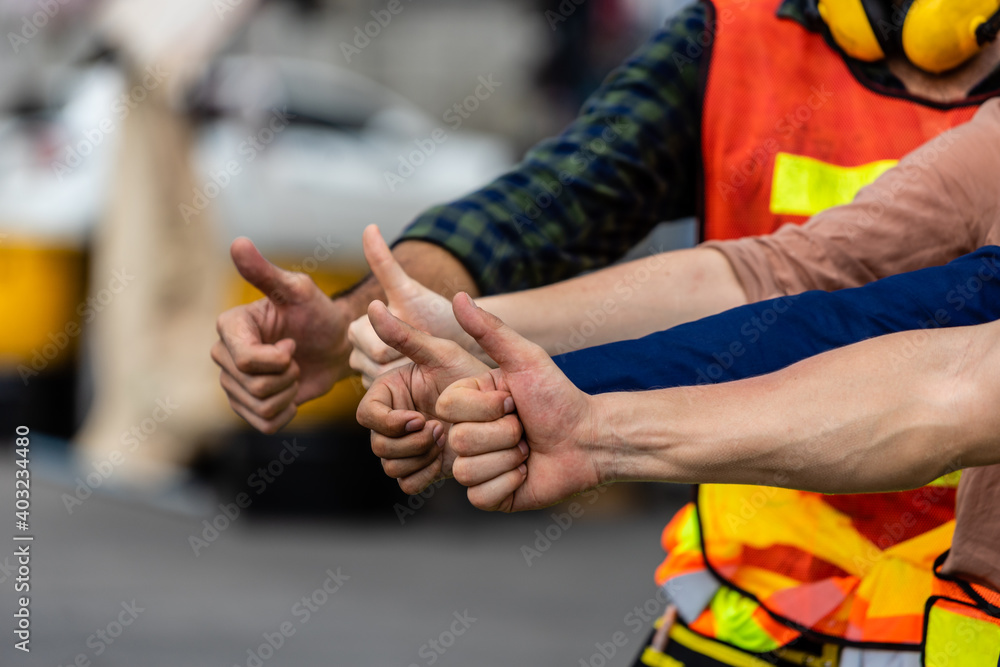 hands of Worker thumbs up Show confidence, encourage the team.