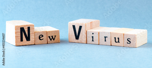 New Virus words arranged from wooden blocks. Concept for medicine and business.