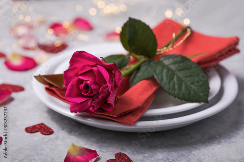 Valentines dinner with table place setting  hearts decoration  rose for valentines days dinner. View from above.