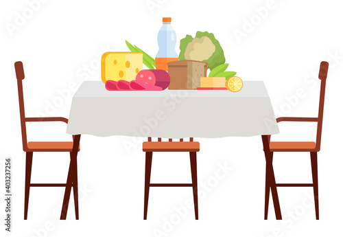 Wooden dining table covered with a table cloth with chairs nearby. Furniture model made of wood for the interior. Arrangement of furniture at home. Table with food isolated on white background