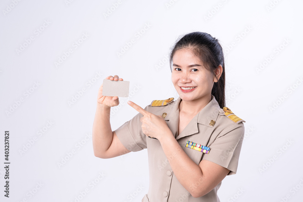 Thai teachers in official uniform holding paper credit card mockup for identification or bank Thai teachers in official uniform holding paper credit card mockup for identification or bank