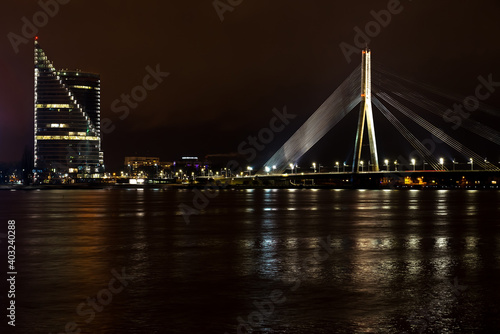Night view of the bridge over the Daugava river © Aleksey Dmetsov