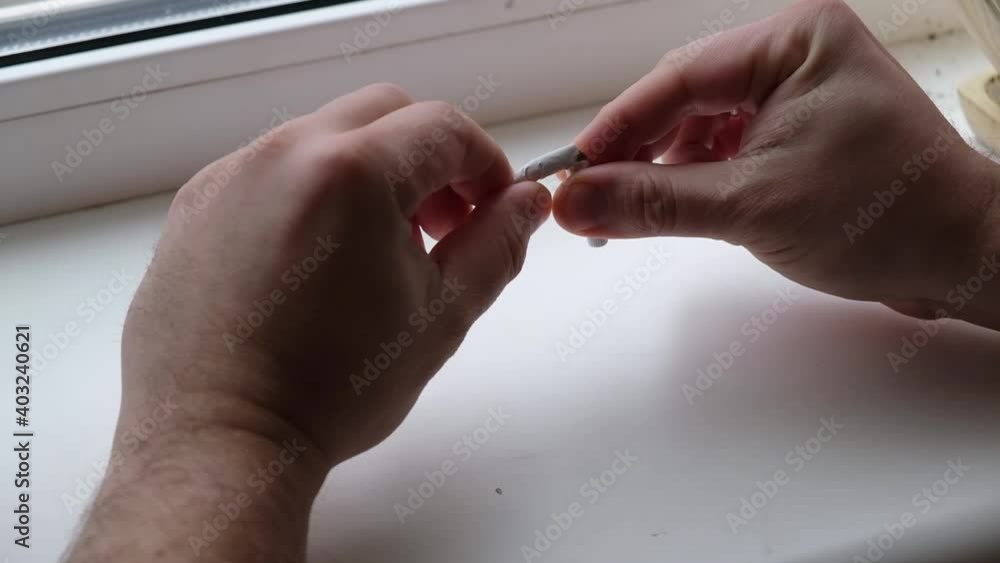 Quit smoking concept. Hands hold and break a cigarette. Quit smoking concept. Hands hold and break a cigarette.