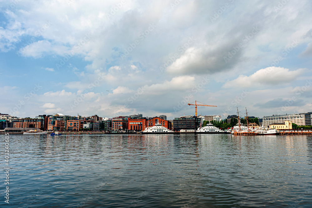 Oslo, Norway, July 27, 2013: port, Oslo's port area with vintage sailboats on a cloudy day. 