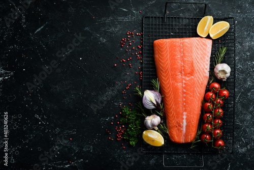 Wallpaper Mural Salmon fillet with rosemary and spices. On a dark background. Top view. Torontodigital.ca